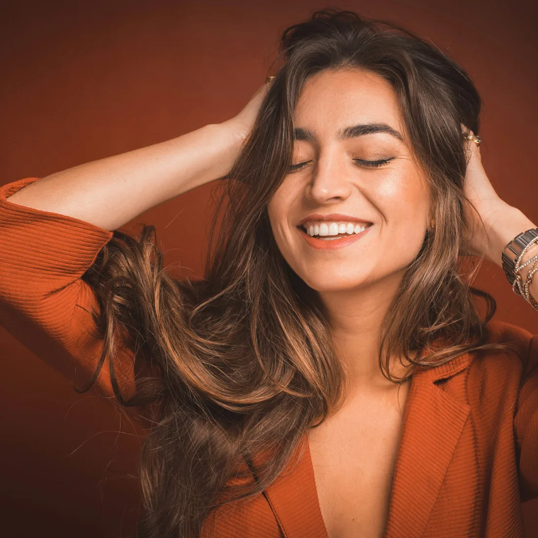 Soft brunette waves and a natural, glossy finish — salon concept photography
